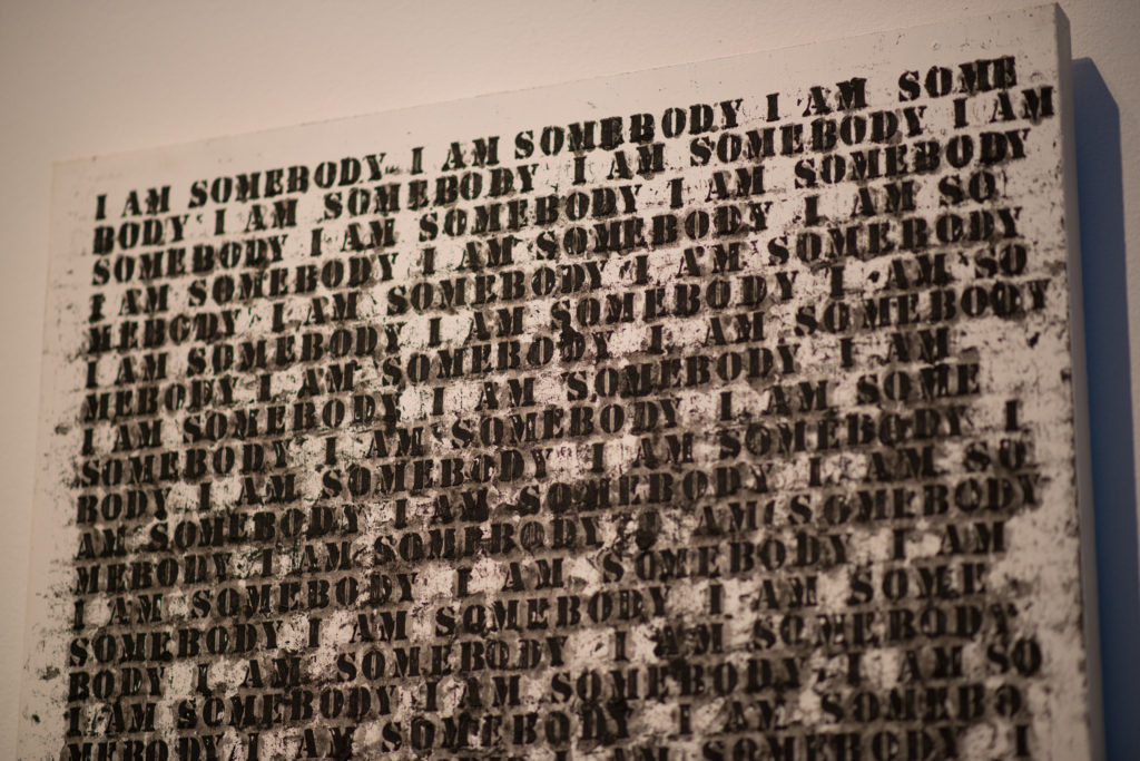 Oil stick, gesso, and graphite on wood artwork by Glenn Ligon, "Untitled (I am Somebody)", it reads "I am somebody" repeatedly