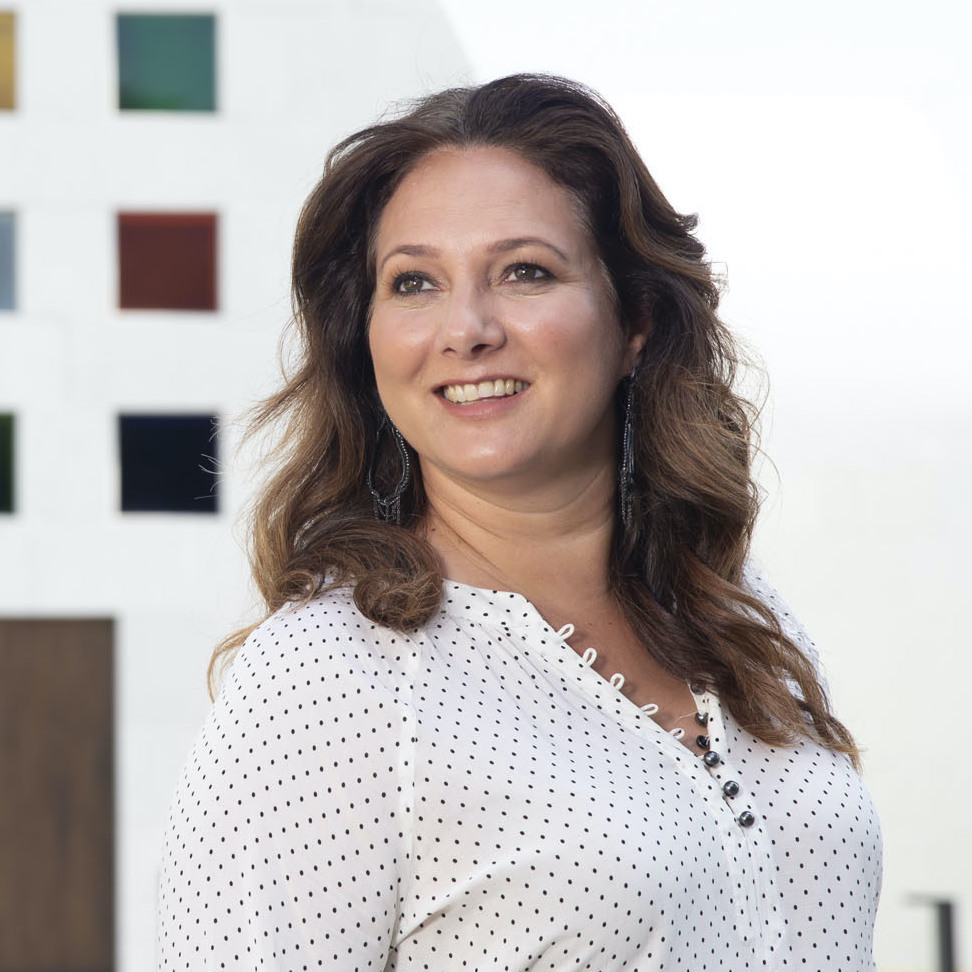 Simone Wicha, the director of the Blanton Museum of Art, stands in front of Ellsworth Kelly's building named "Austin"